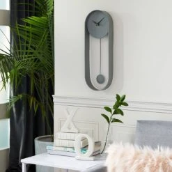 20" x 7.5" Oval Metal Pendulum Wall Clock - Olivia & May Pink