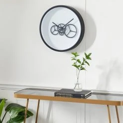 Olivia & May 18" x 18" Round Metal Wall Clock with Functioning Gear Center Black/White - Olivia & May